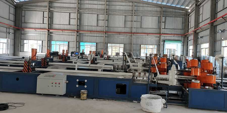 Manufacturing Capabilities Industrial pultrusion lines and molding facility inside the composite manufacturing plant.