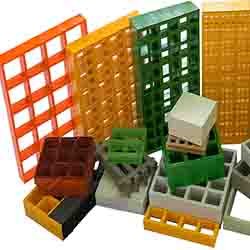 Molded and pultruded FRP grating with 25mm to 50mm thickness matrices for corrosive industrial flooring.